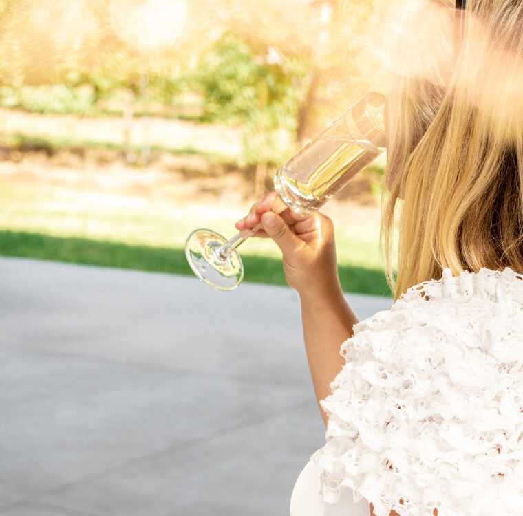 Woman Drinking A Glass Of Champagne